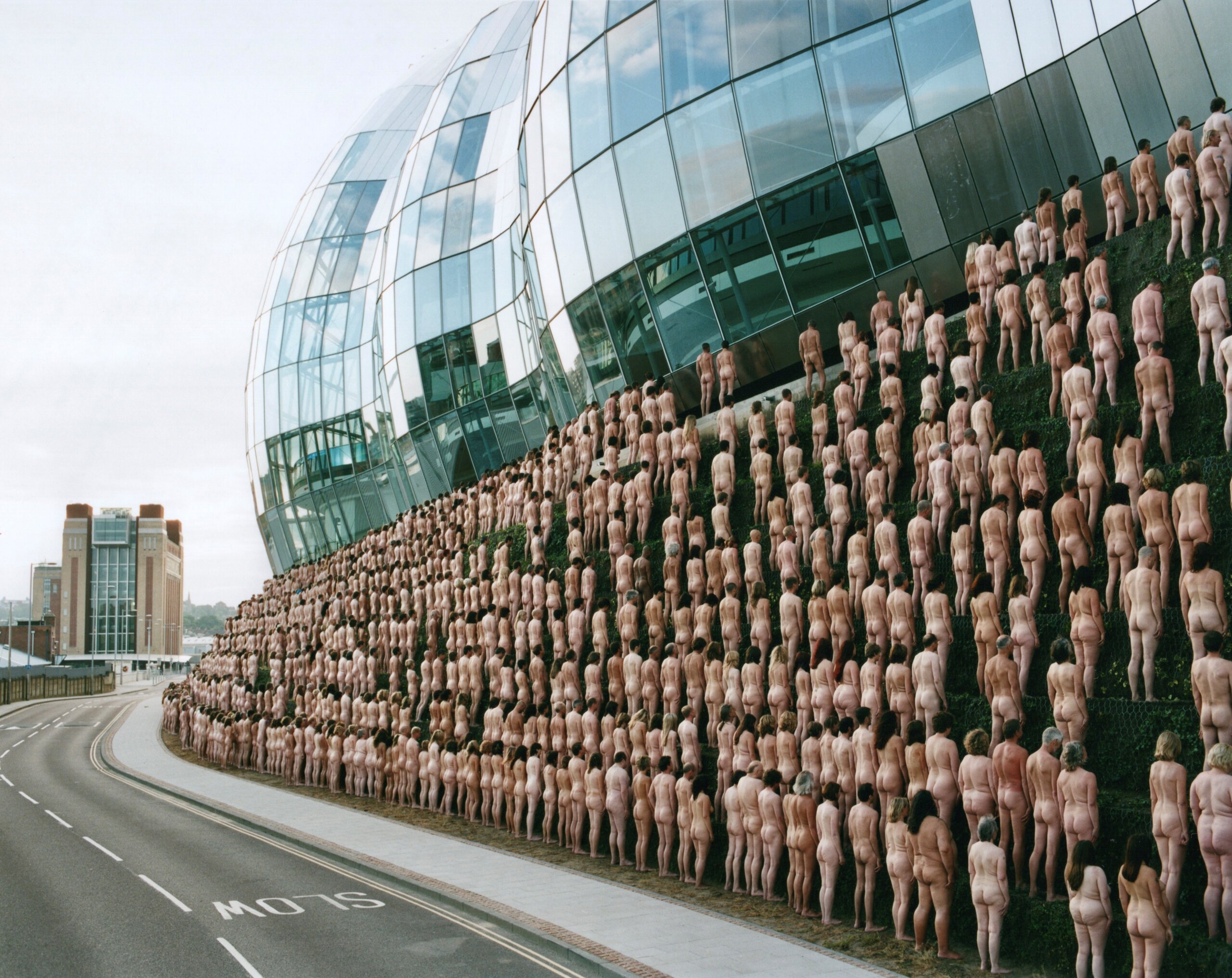 Nudes to drape Brisbane’s iconic Story Bridge as Spencer Tunick returns for Melt Open in October 2024.