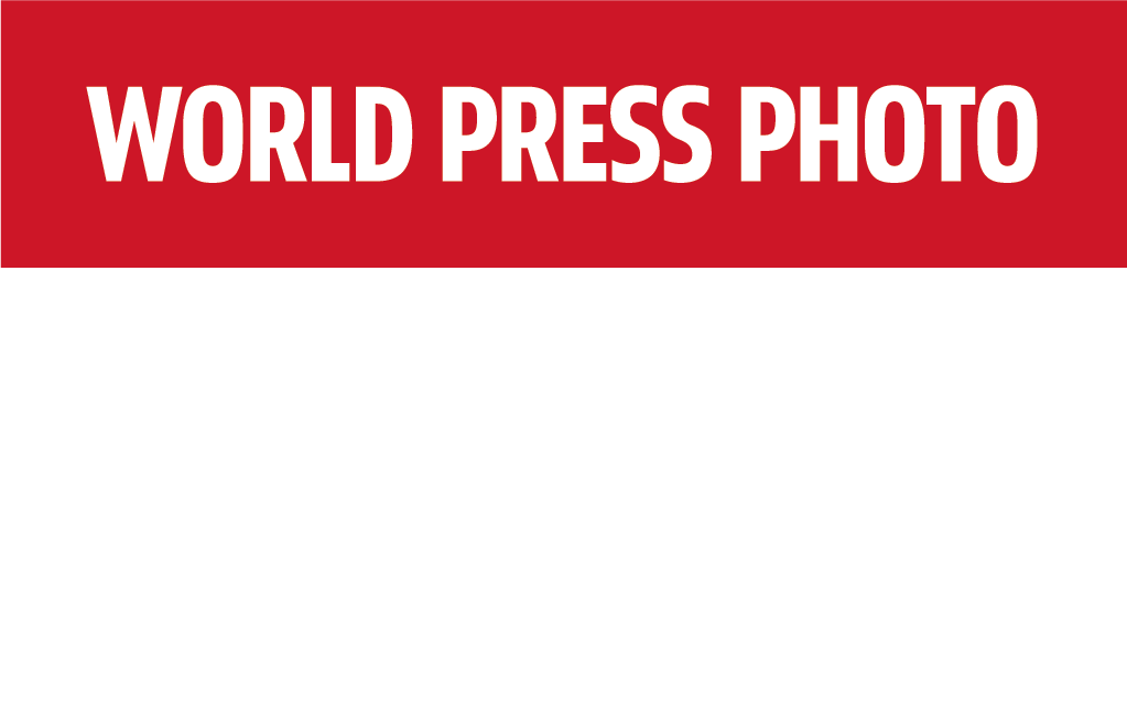 Red and white graphic with bold text: WORLD PRESS PHOTO at the top, with faint white text below reading EXHIBITION 2026. Inspired by the World Press Photo Exhibition 2025 Brisbane Powerhouse branding.