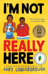 Book cover for Im Not Really Here by Gary Lonesborough, featuring two boys in sportswear, one holding a basketball. The background is yellow with award badges and bold, colorful text.