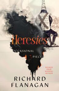 Book cover for Heresies: Occasional Pieces by Richard Flanagan, showing a burning, charred section, a person in a dunce cap sitting with back turned, and bold orange and black text.