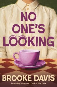 A person in a buttoned-up shirt sits at a table with a pink teacup and saucer in front. The text No Ones Looking is written in large purple letters over the image.