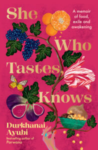 Book cover of “She Who Tastes, Knows” by Durkhanai Ayubi, featuring colorful illustrations of fruits, flowers, a butterfly, and a jeweled hand on a pink background. Subtext: A memoir of food, exile and awakening.