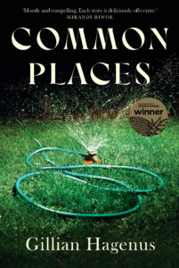 A green garden hose sprays water in circular patterns on grass. The book title COMMON PLACES and author Gillian Hagenus are displayed, along with a sticker that reads literary awards winner.